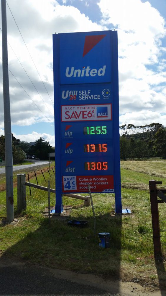 Blue United petrol station pylon sign with digital fuel price displays