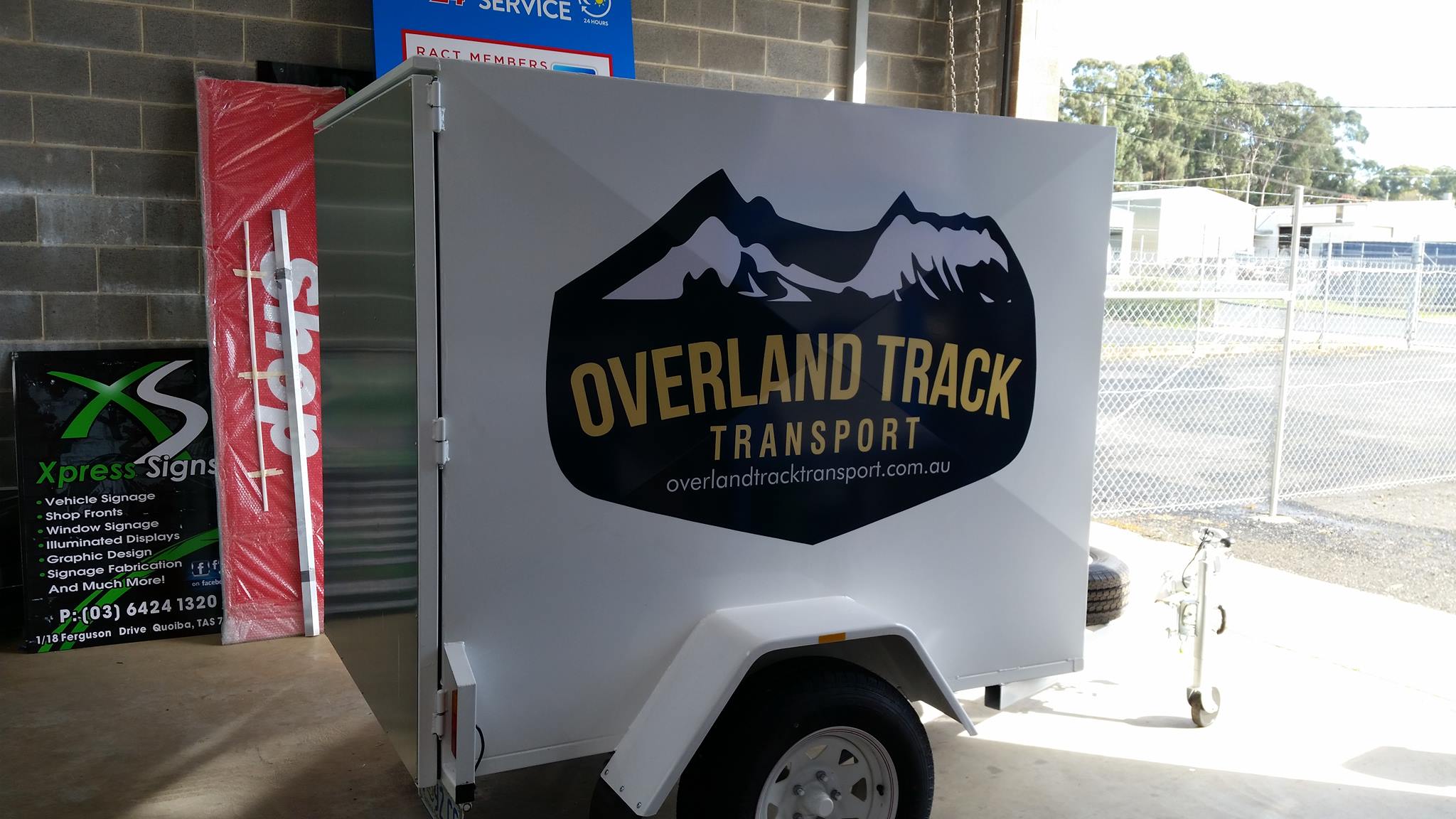 Custom vinyl decal install on the Overland Track Transport trailer